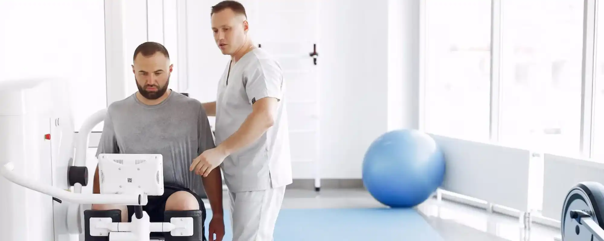 doctor-with-patient-physiotherapy-clinic_1157-38487-1 (1)