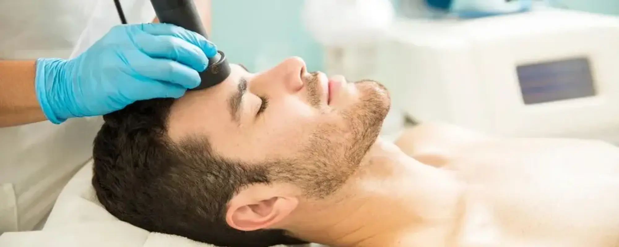 profile-view-good-looking-young-man-getting-rf-facial-treatment-health-spa_662251-2575 (1) (1)